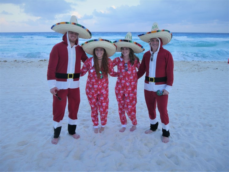 Family Christmas pajamas on beach in Mexico