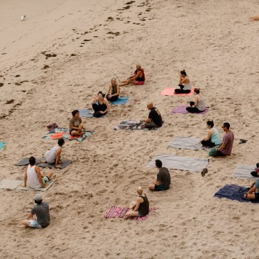 Beach yoga class with out of town wedding guests in Spain. Photos by Jonathan Gipaya