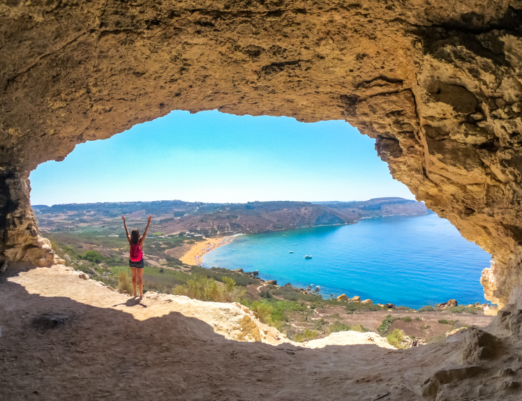 Tal Mixta Cave overlooking Ramla Bay in Gozo, Malta