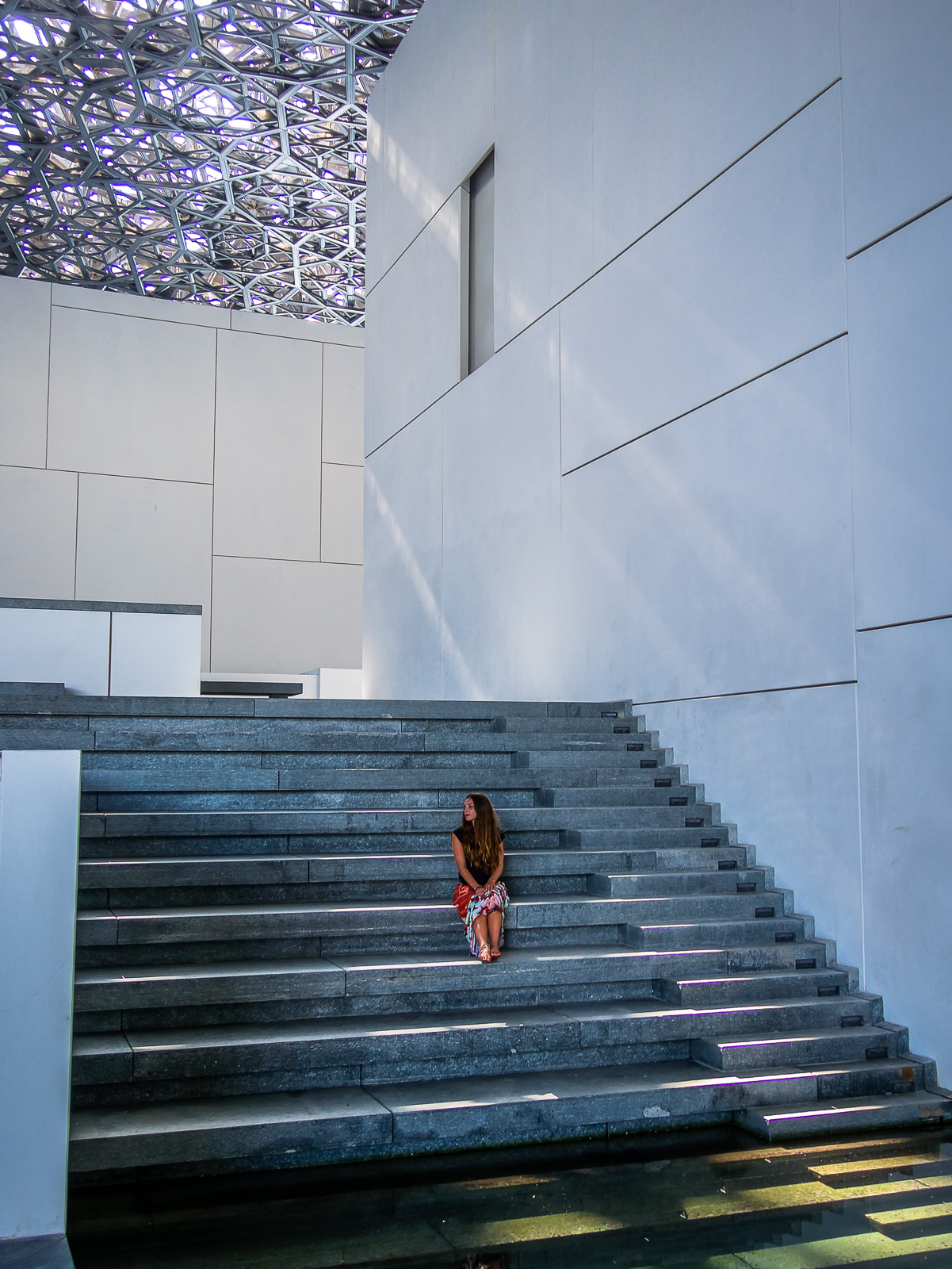 Staircase leading to water in the Louvre Abu Dhabi