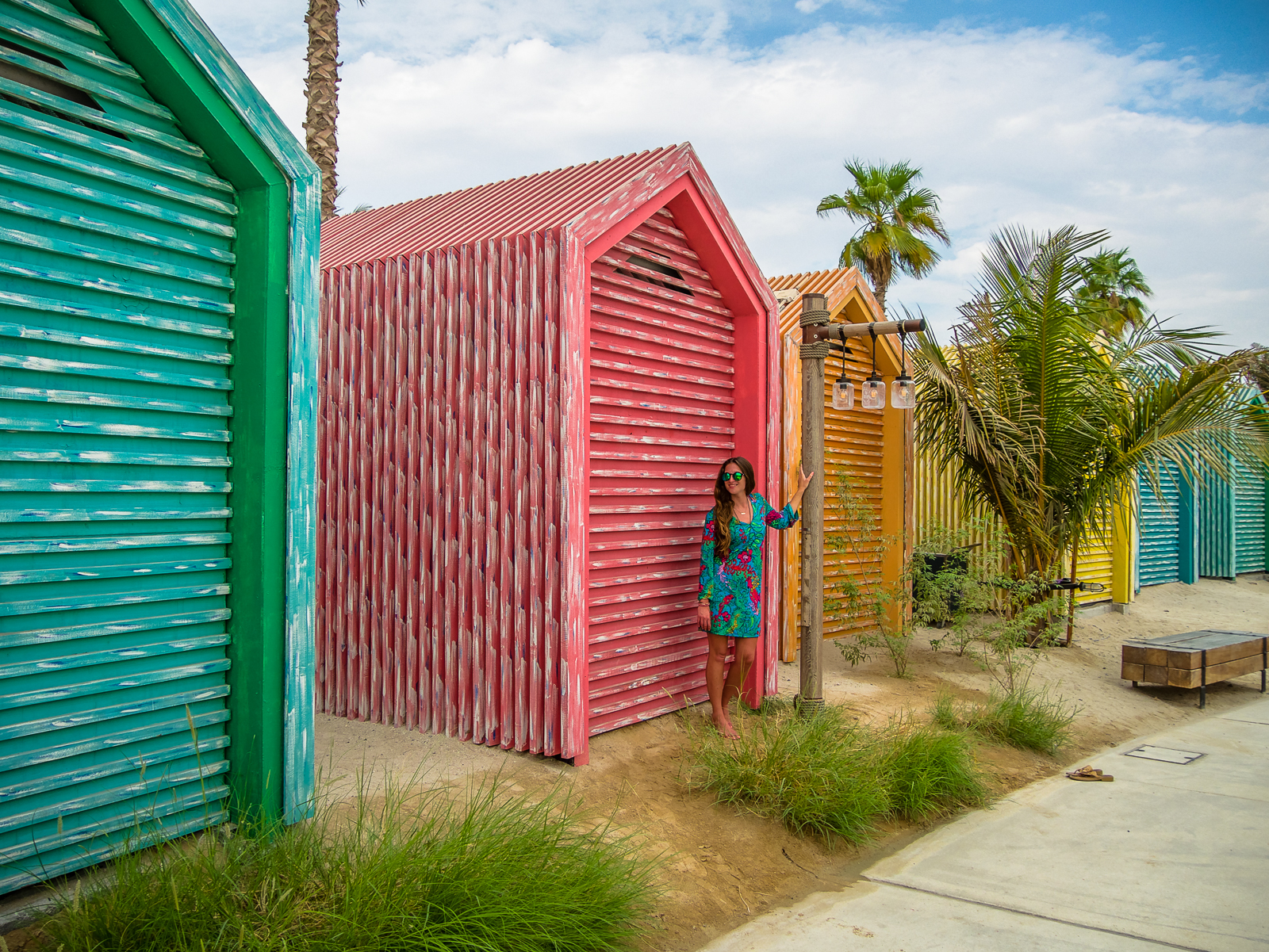 Colorful beach huts on the boardwalk at La Mer