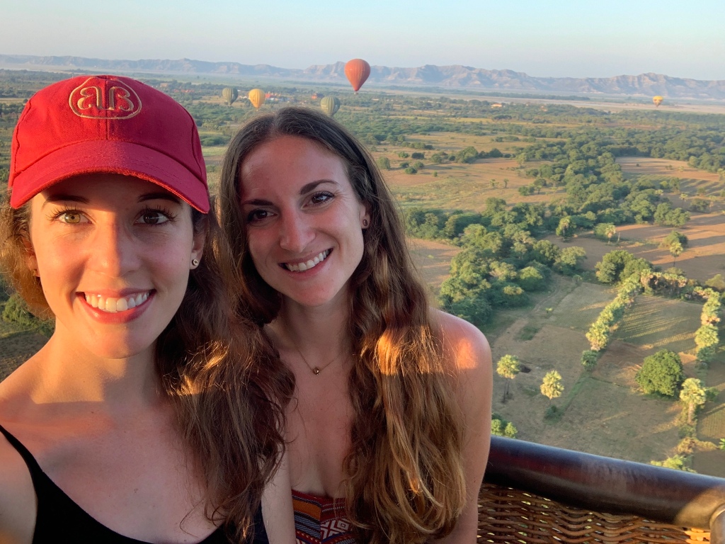 Two brunette travellers in a hot air balloon in Bagan, Myanmar