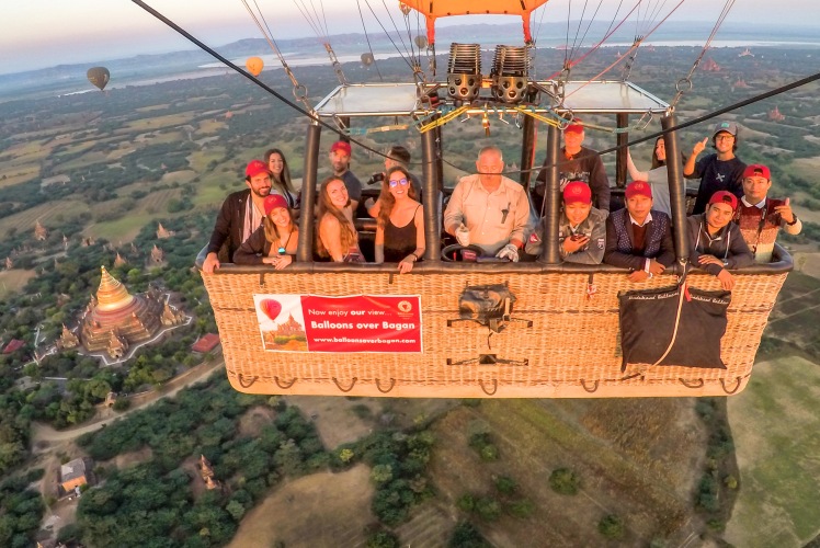 Hot Air Balloon Group during flight above the temples of Myanmar at sunrise